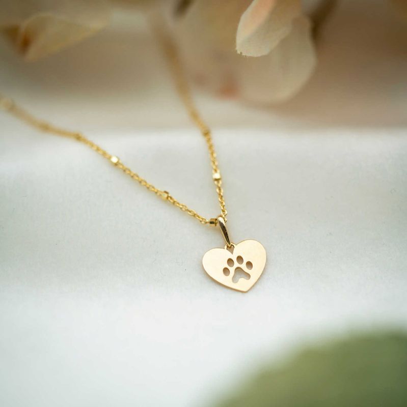 Anheng i gull Poten hjerte